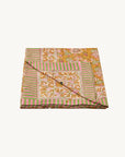 Doing Goods Marigold Table throw in tote bag